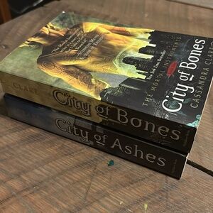 City of bones and city of ashes by Cassandra Claire paperback.
